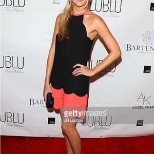 This gorgeous black dress with pink scalloping was seen on Stephanie Pratt.